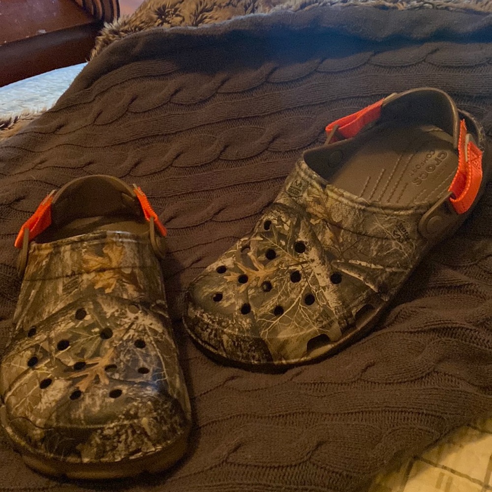 New, camo with orange strap CROCS. Never been worn. Mens size 11